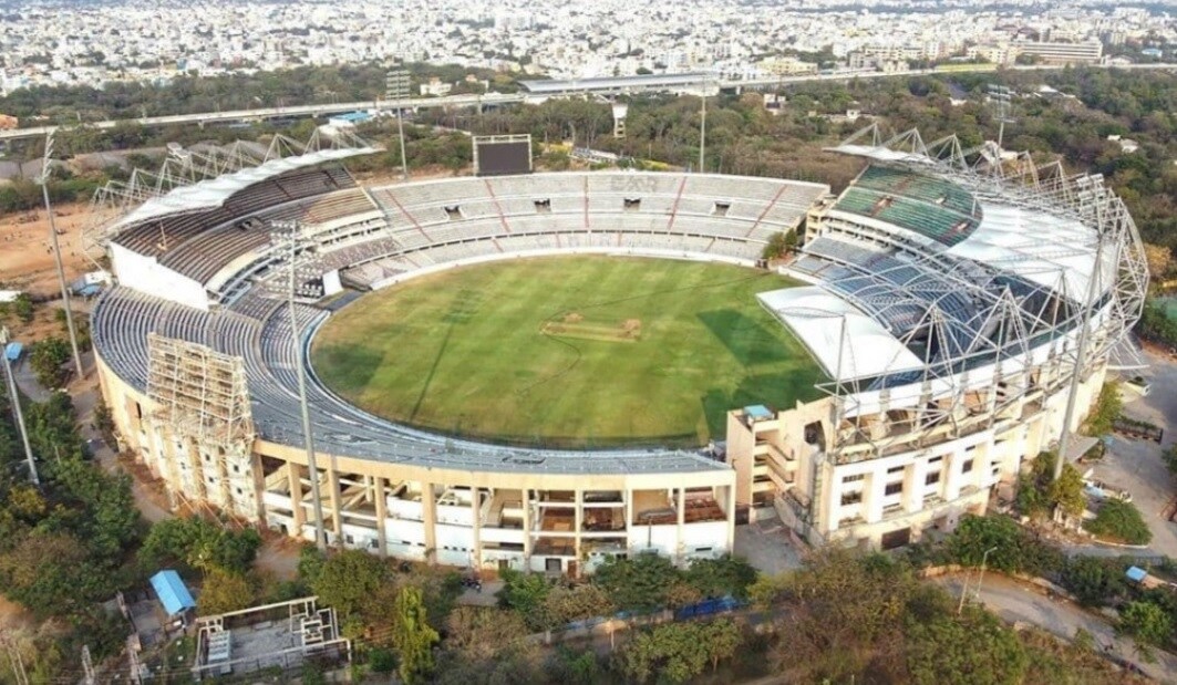 Uppal_a large stadium with a large building