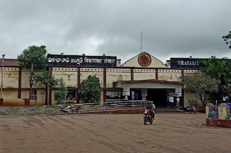 Vikarabad_a man is standing in front of a building