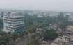 Aliganj_a cityscape of a city with tall buildings