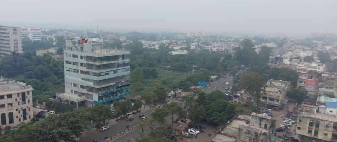 Aliganj_a cityscape of a city with tall buildings