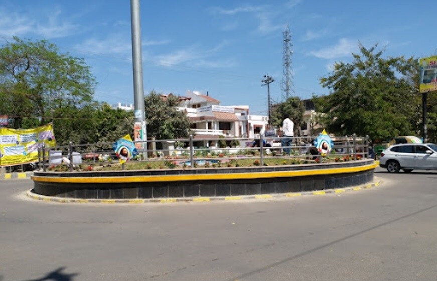 Ashiyana_a large group of people standing on top of a sidewalk