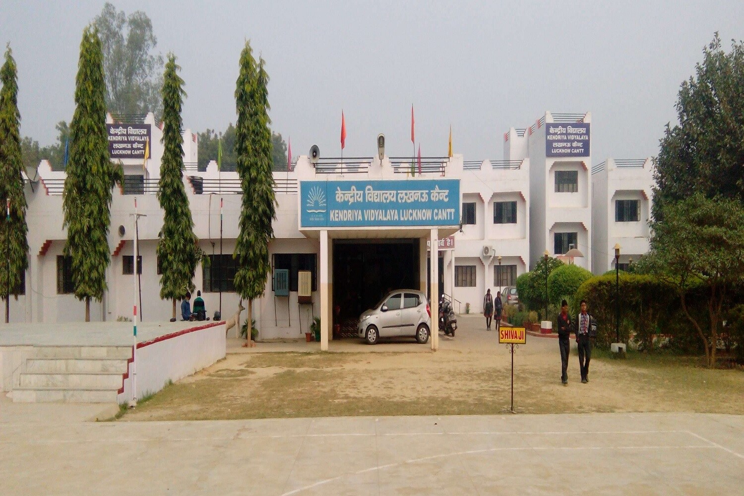 Cantonment_a car parked in front of a building with graffiti on it
