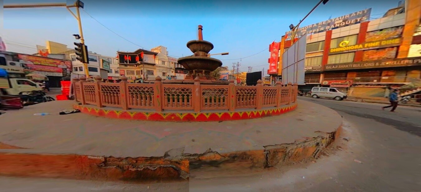 Chowk_a large statue of a man on top of a fire hydrant