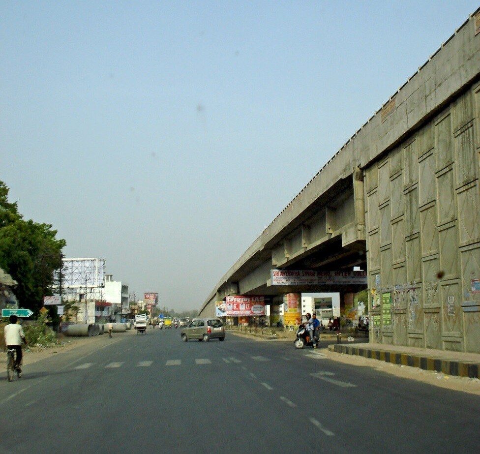 Faizabad Road_a city street with a street sign on the side of the road