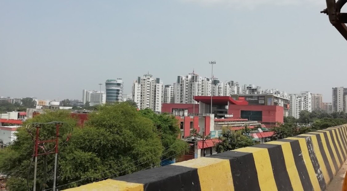 Gomti Nagar_a large building with a fence on top of it