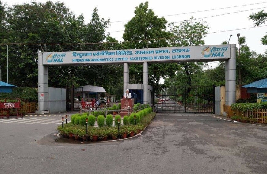 HAL_a sign on a pole in front of a building