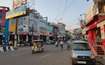 Mahanagar_a city street filled with cars and pedestrians