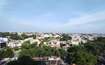 Mahanagar_a city with a lot of trees and houses
