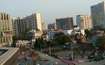 Vibhuti Khand_a city street filled with lots of tall buildings