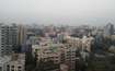 Amboli_a city with tall buildings and a sky background