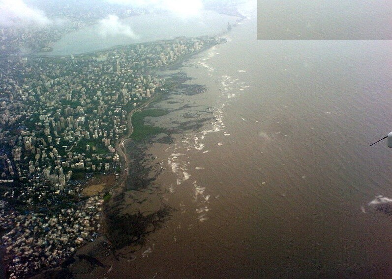 Bandra West_a large body of water with a city skyline