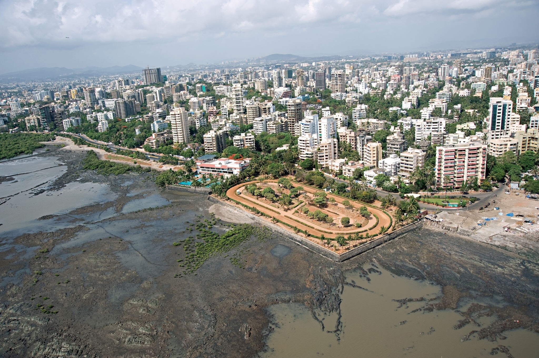 Bandra West_a large body of water surrounded by tall buildings