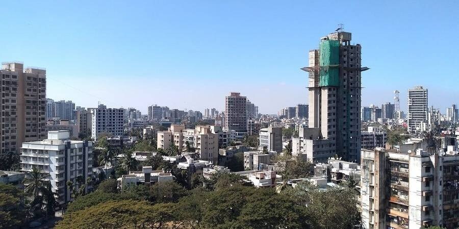 Borivali East_a city with tall buildings and a clock tower