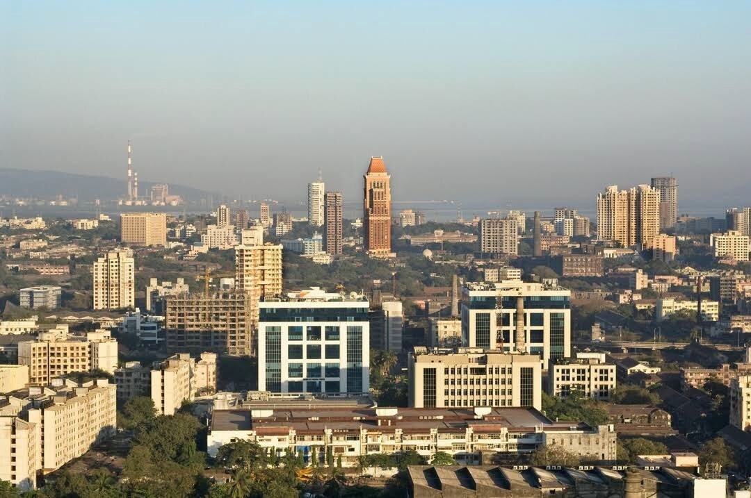 Chembur_a city with tall buildings and a sky background