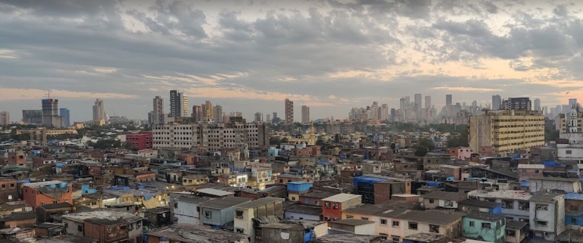 Dharavi_a city with lots of tall buildings and a sky background