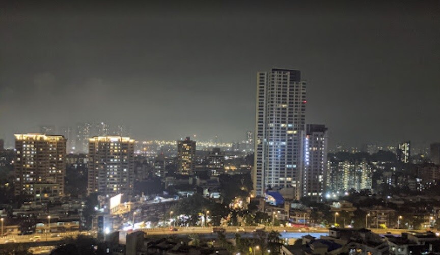 GTB Nagar_a city at night with skyscrapers in the distance