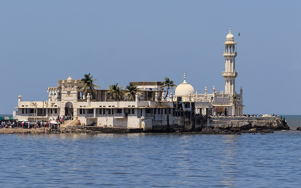 Haji Ali_a large white boat sitting on top of a body of water