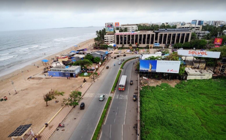 Juhu_a beach with a lot of cars parked on it
