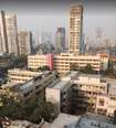 Kamathipura_a city with tall buildings and tall buildings