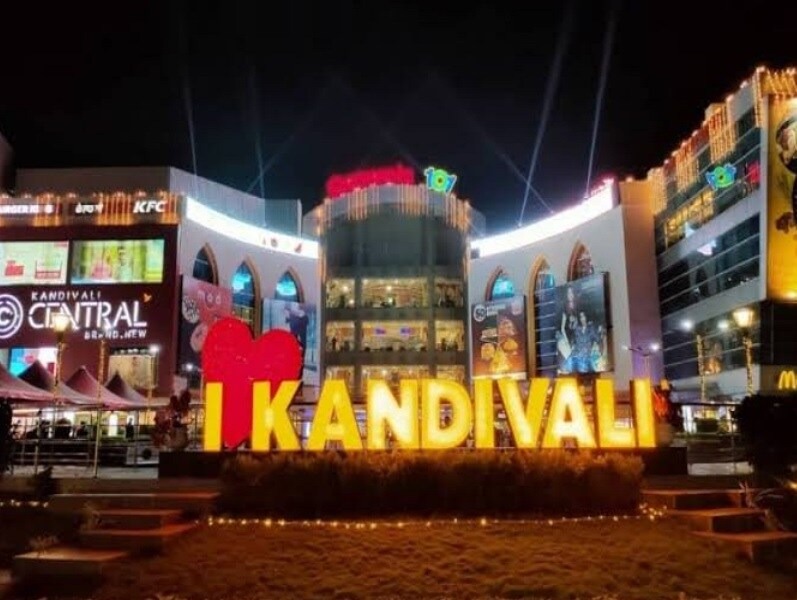 Kandivali East_a large building with a neon sign on top of it