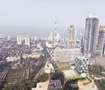 Kurla_a city with tall buildings and a sky background
