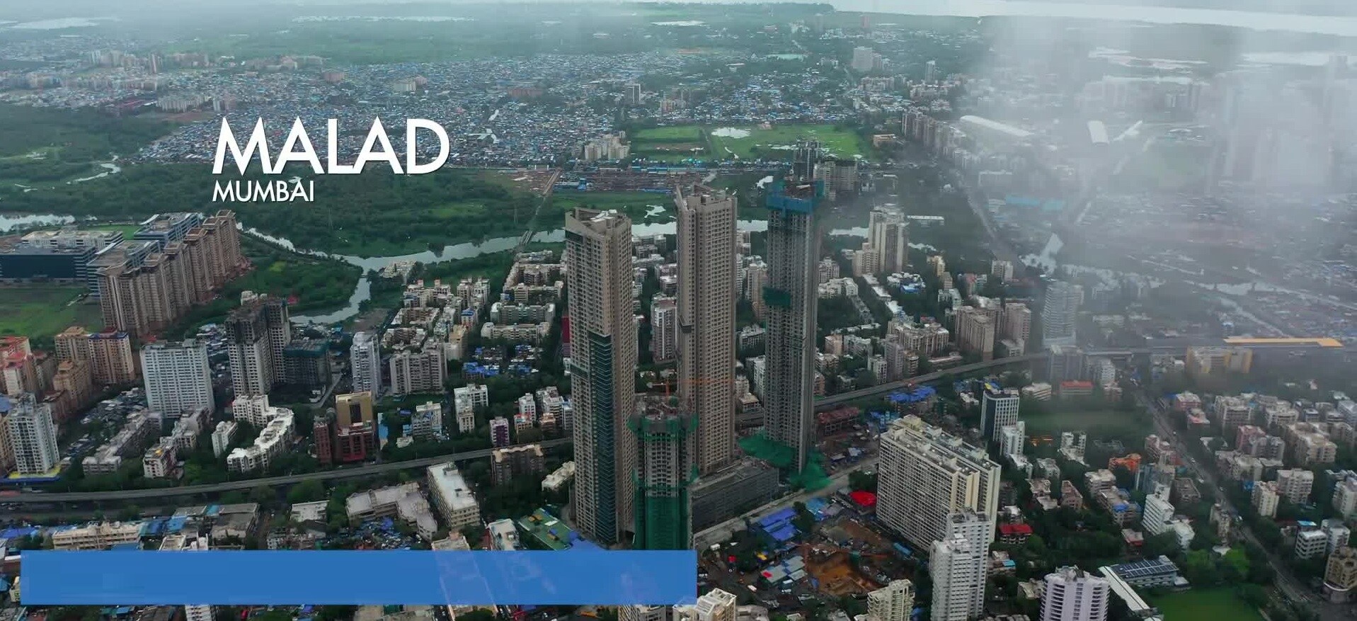 Malad West_a cityscape of a city with a large building