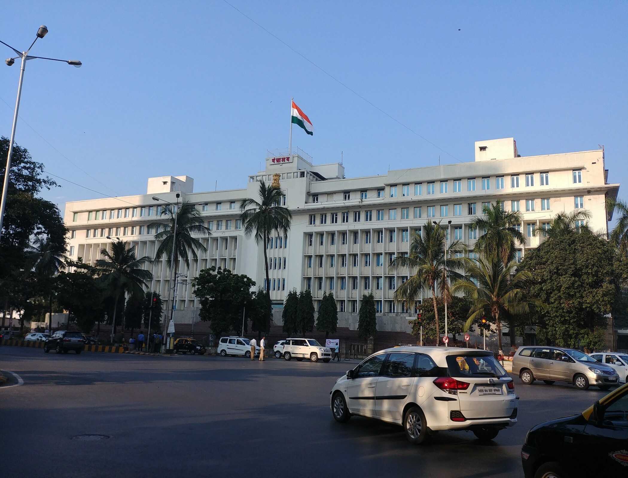 Mantralaya_a car is parked in front of a large building