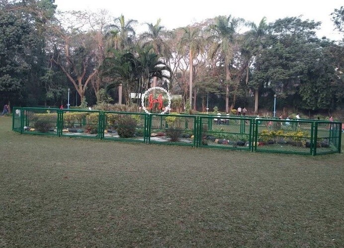 Mulund West_a green fence surrounds a green field