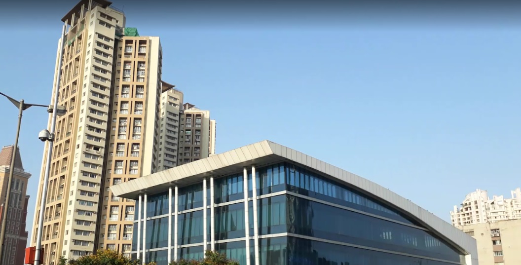 Pratap Nagar_a tall building with a clock on the top of it