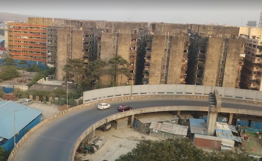 Shivaji Nagar_a large building with a lot of graffiti on it