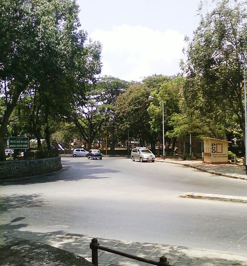 Wadala_a city street with cars parked on the side of the road