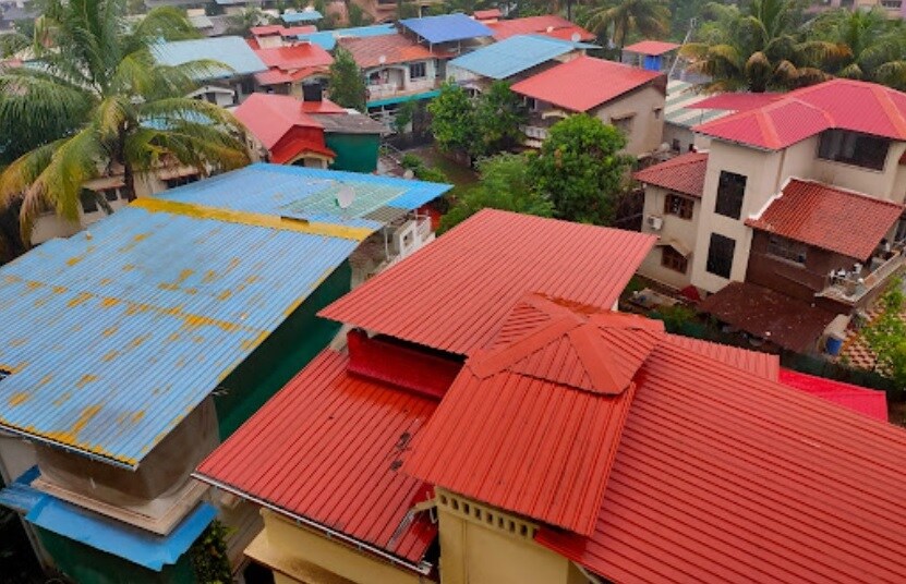 Pen_a row of colorful umbrellas on top of a building