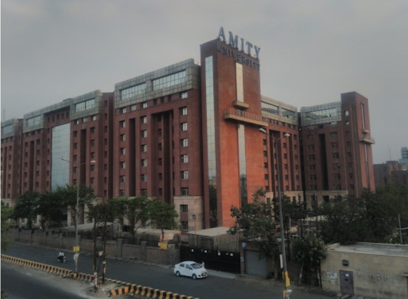 Sector 125_a large building with a clock on the side of it