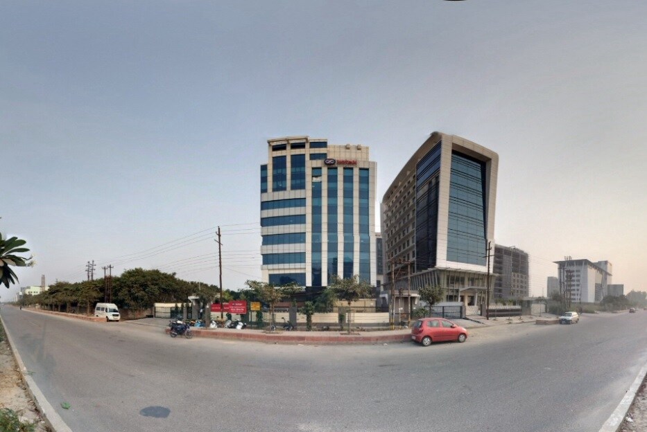 Sector 125_a city street filled with lots of tall buildings