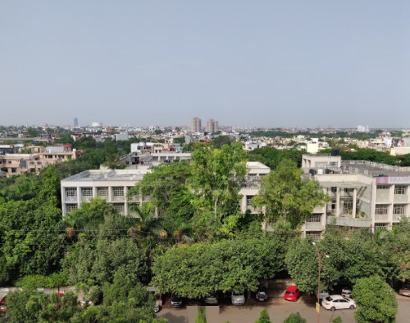 Sector 56_a large building with trees and houses