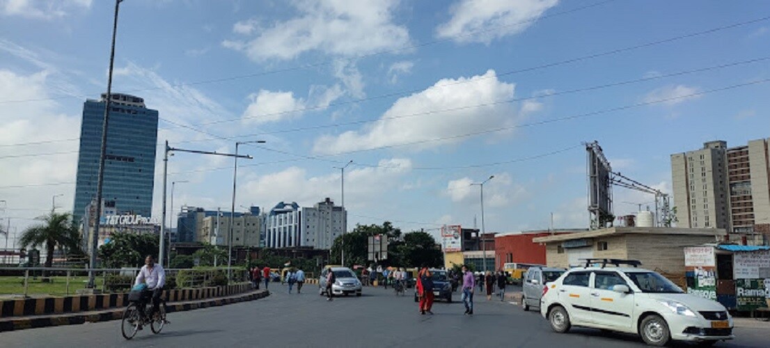 Sector 62_a city street filled with cars and pedestrians