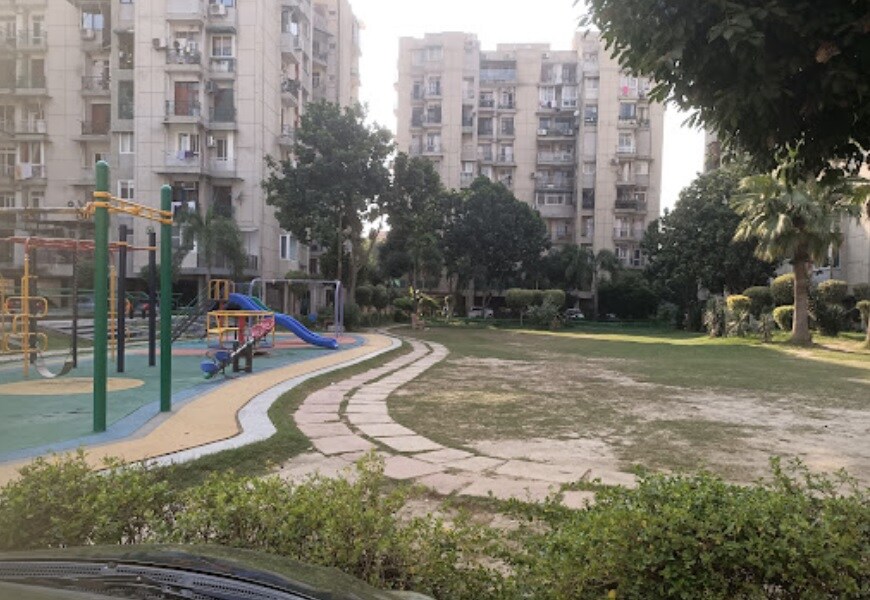 Vivek Vihar_a park with a lot of green grass and trees
