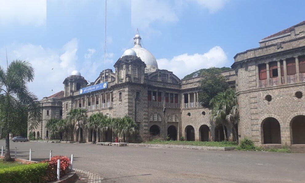 Ashok Nagar_a large building with a clock on the front of it