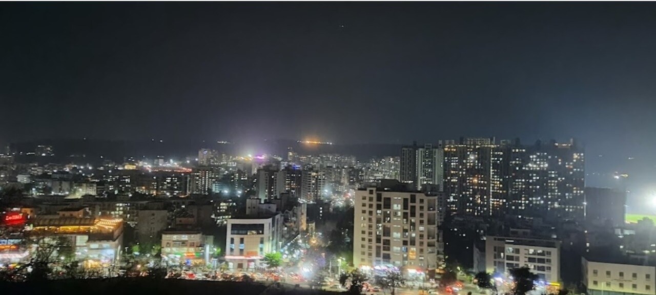 Bavdhan_a city at night with lots of tall buildings