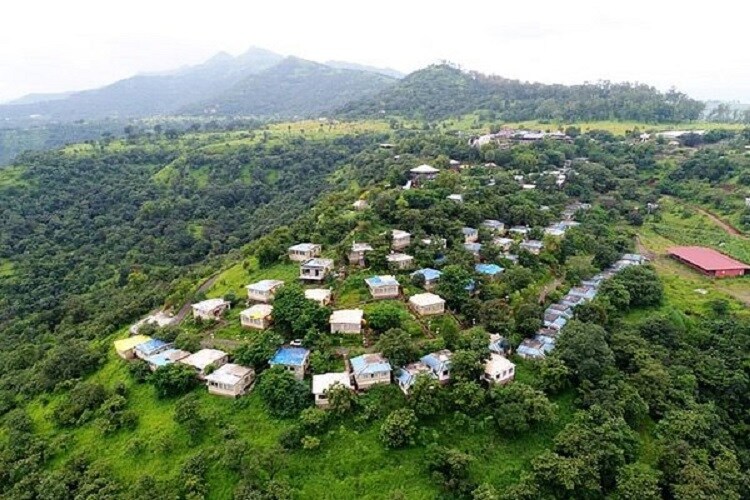 Bhor_a field full of tents and animals on top of a hill