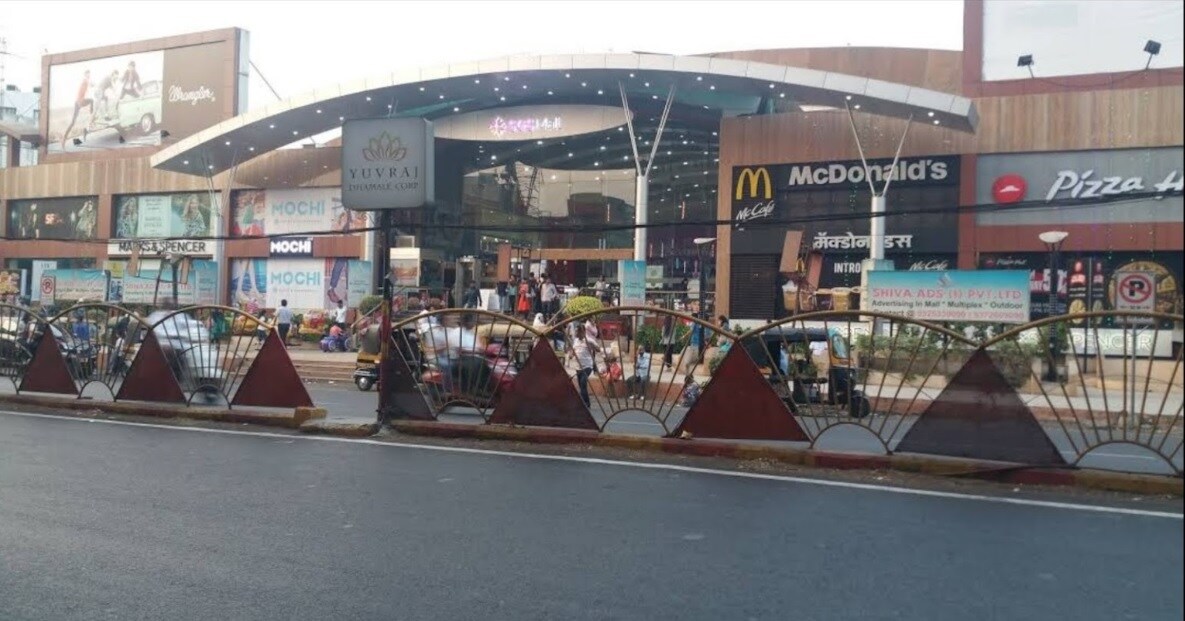 Camp_a street sign with people walking down it