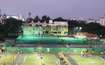 Deccan Gymkhana_people playing a game of tennis on a green court