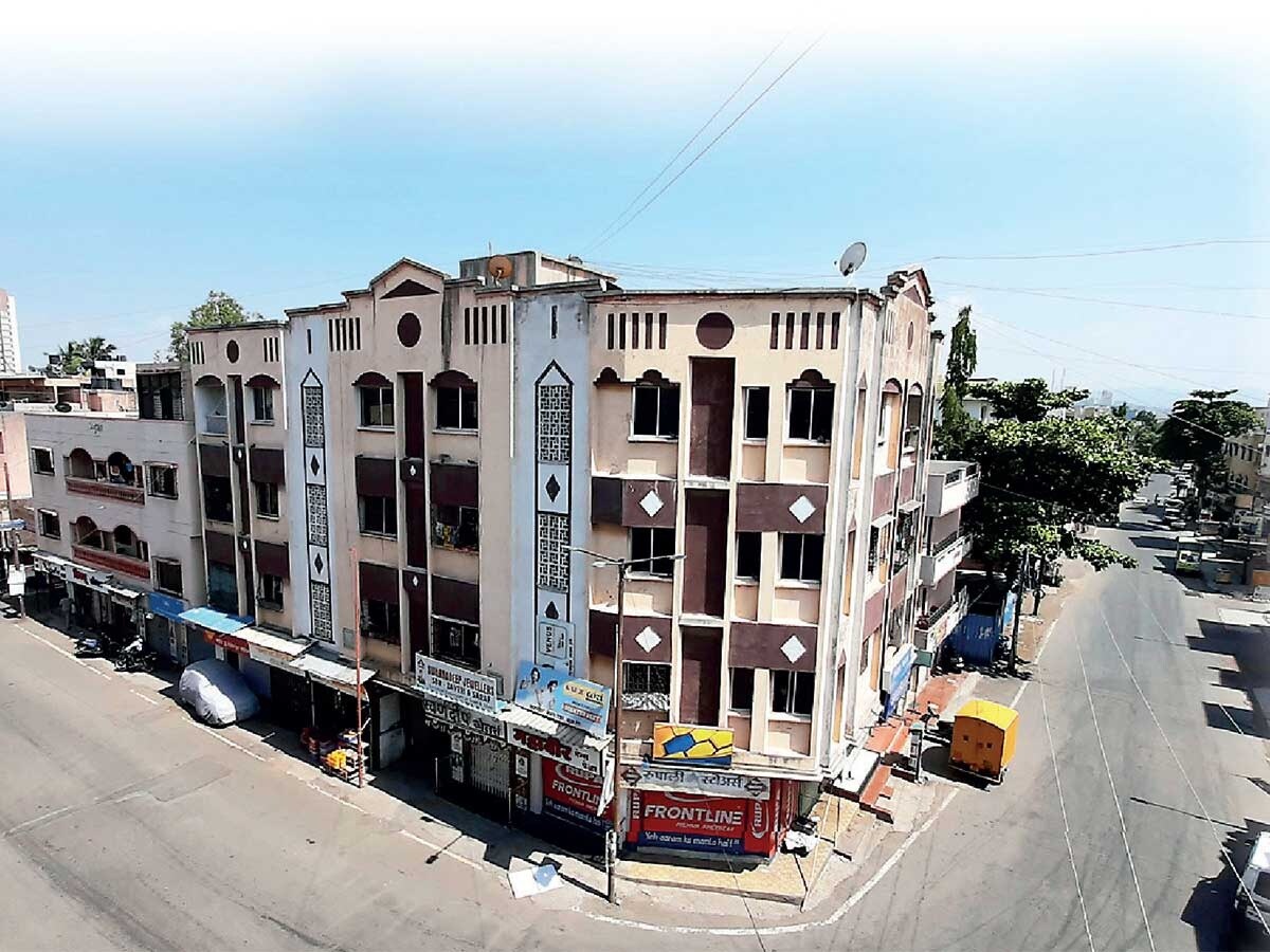 Ganesh Nagar_a street scene with a train on the tracks