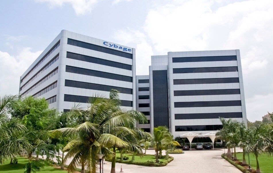 Kalyani Nagar_a large building with palm trees in front of it