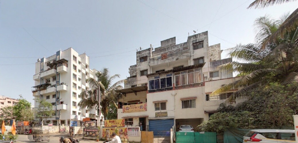 Kirti Nagar_a large building with a lot of windows on top of it