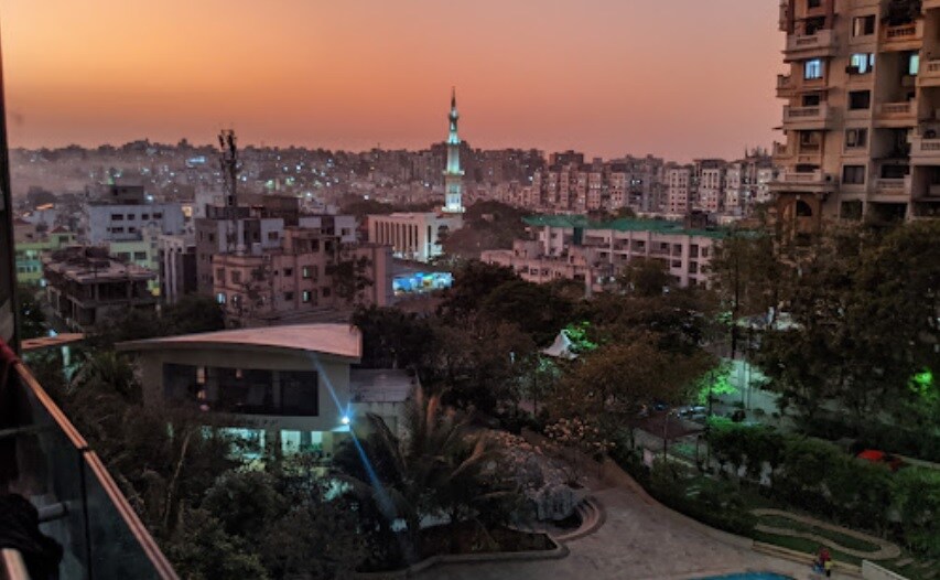 Kondhwa_a city with tall buildings and a clock tower