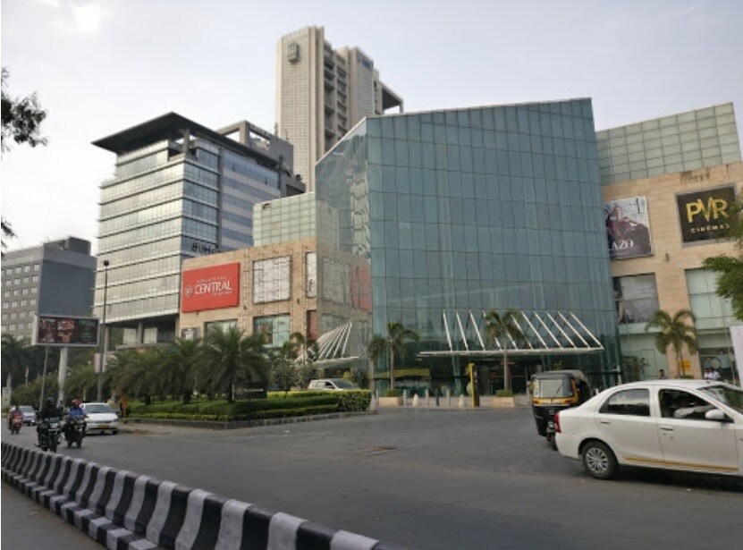 Koregaon Park_a city street filled with lots of cars and buildings
