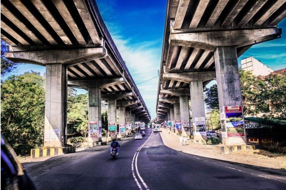 Lonavala_a city street with a bridge over it