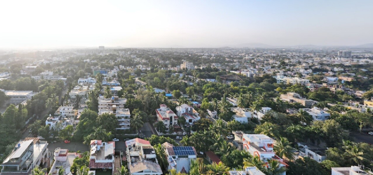 MIDC_a city with lots of tall buildings and trees