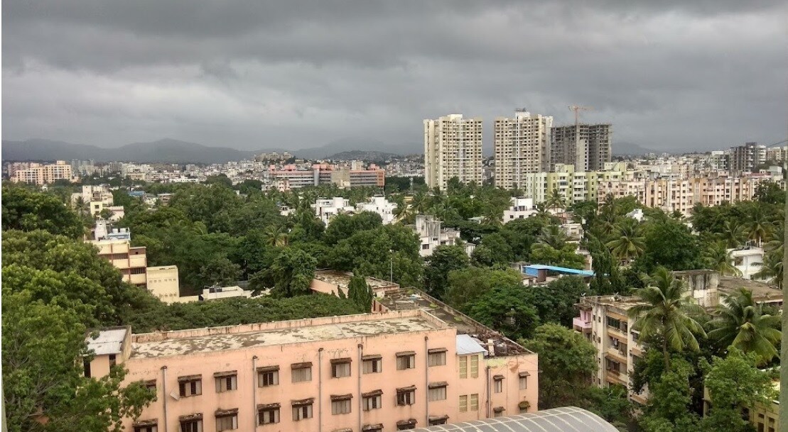 Padmavati_a city with tall buildings and trees